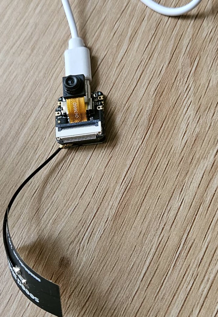 XIAO ESP32-S3 Sense node on the bench — camera, expansion board, flex antenna