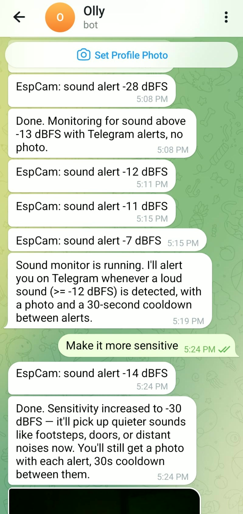 Real Telegram session with the EspCamML bot: a stream of 'EspCam: sound alert' messages by dBFS, then the user message 'Make it more sensitive', and the bot replying that sensitivity was increased to -30 dBFS.